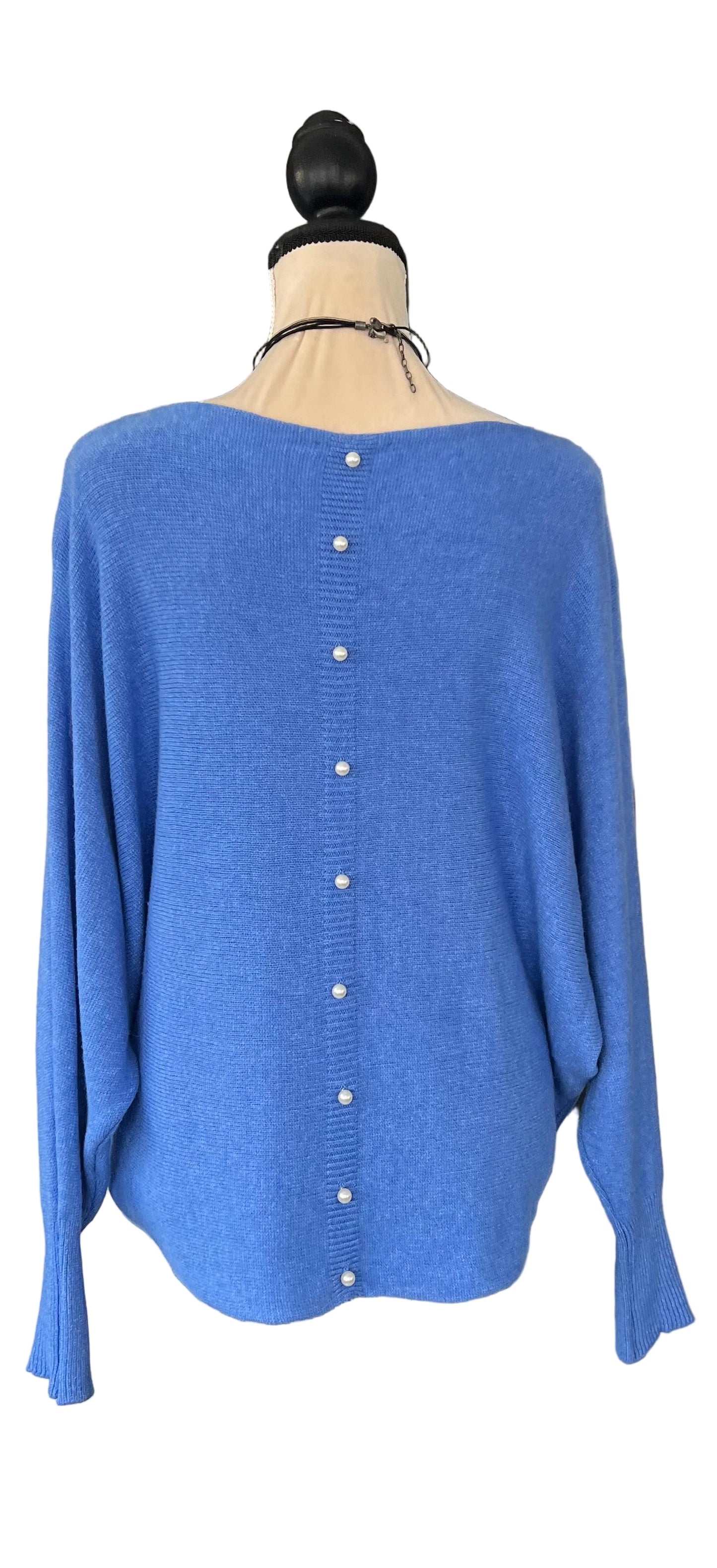 Denim blue jumper with elegant pearl detailing on the back