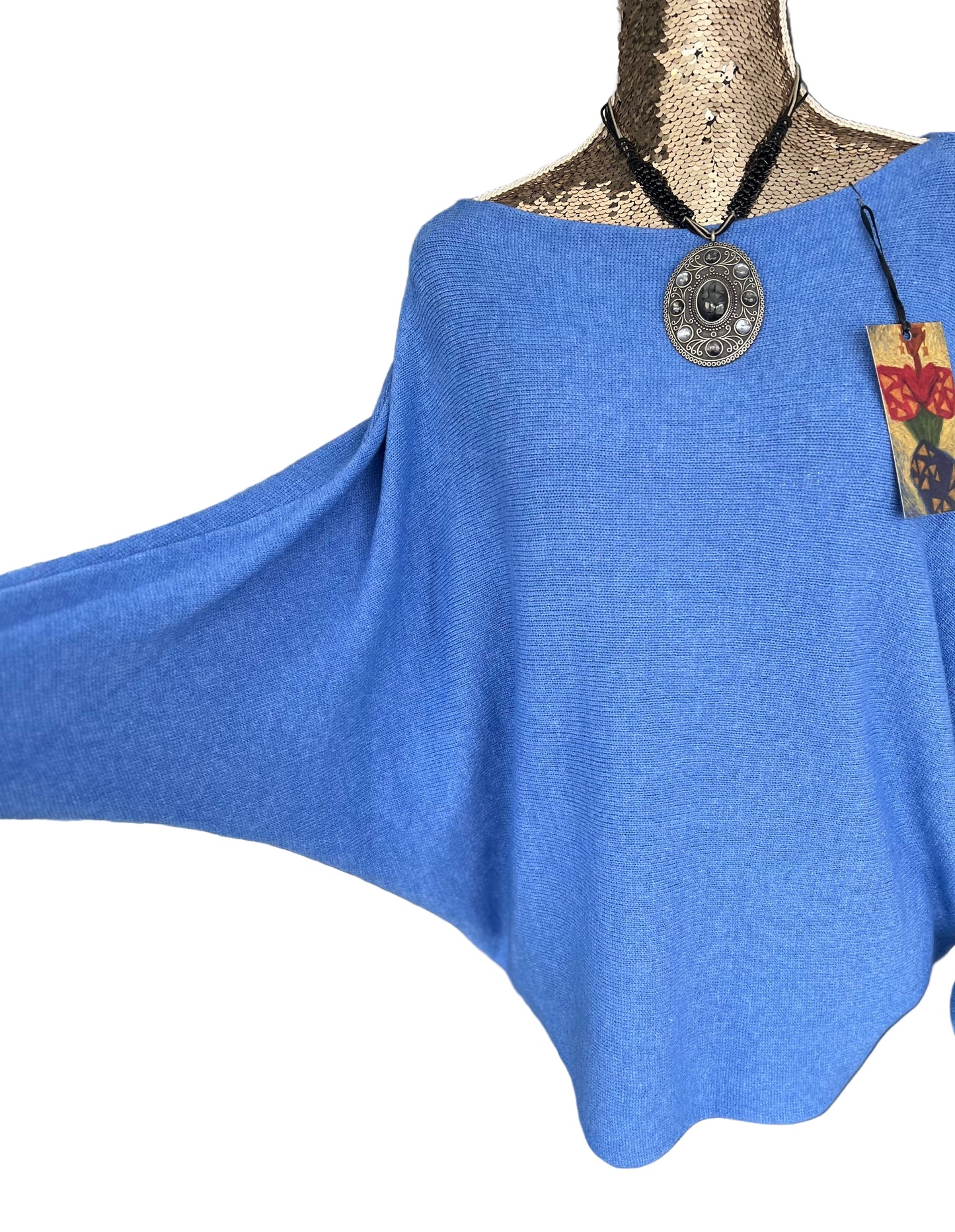 Denim blue jumper with elegant pearl detailing on the back