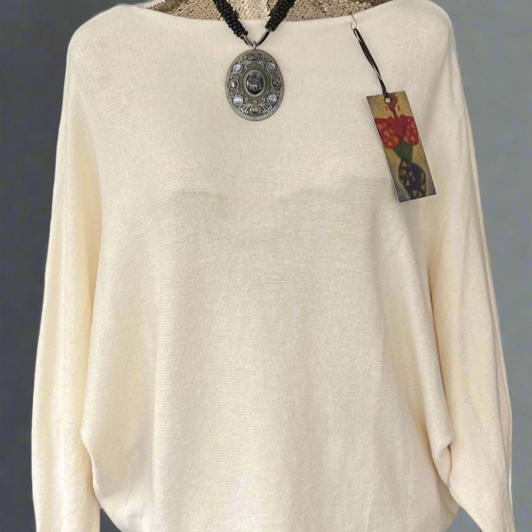 Cream jumper with elegant pearl detailing on the back
