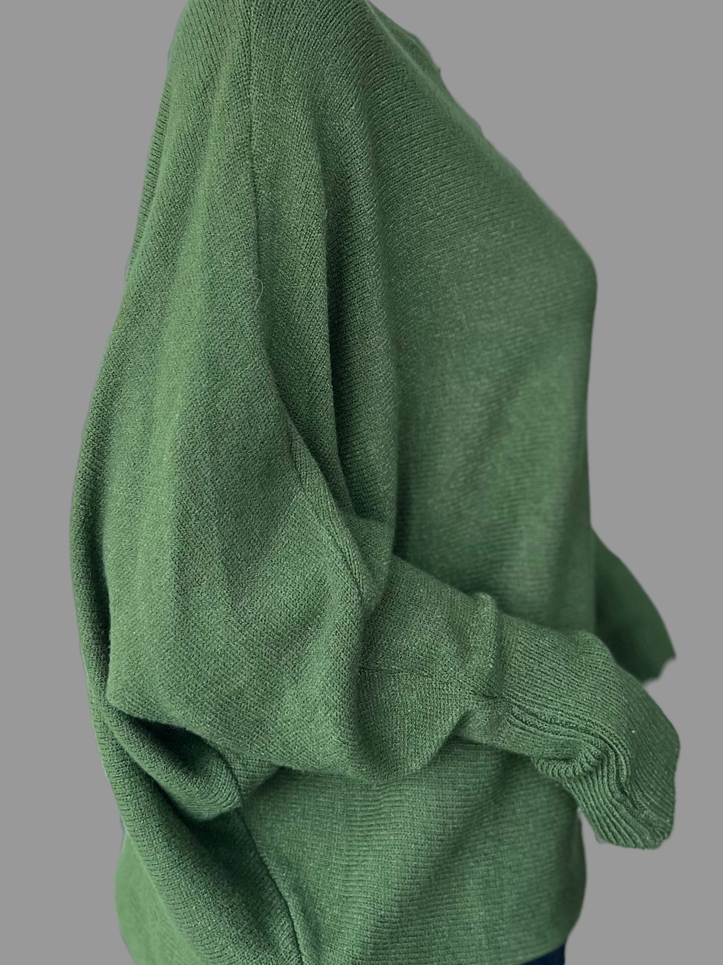 Khaki green jumper with elegant pearl detailing on the back