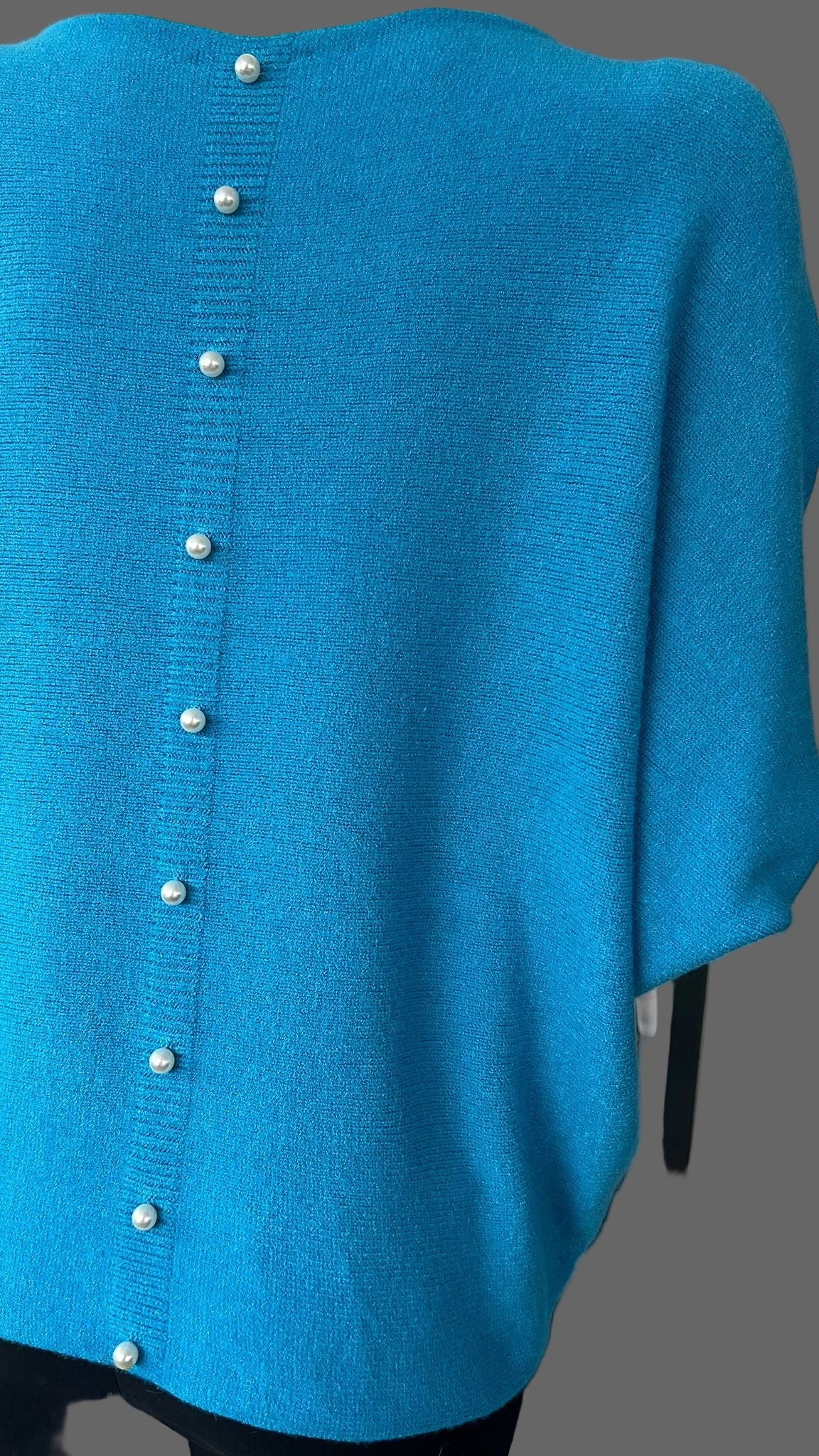 Turquoise jumper with elegant pearl detailing on the back