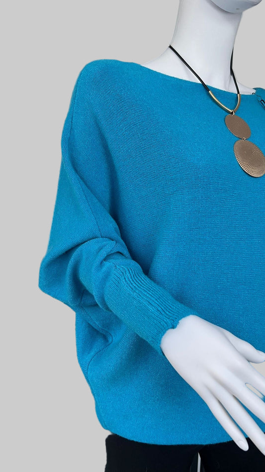 Turquoise jumper with elegant pearl detailing on the back
