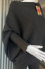 Black asymmetrical jumper with batwing sleeves