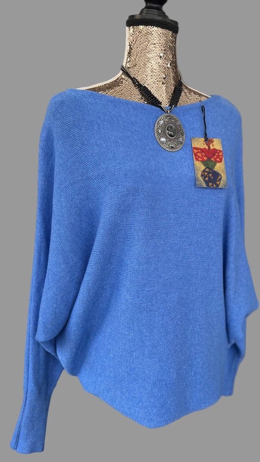 Denim blue jumper with elegant pearl detailing on the back
