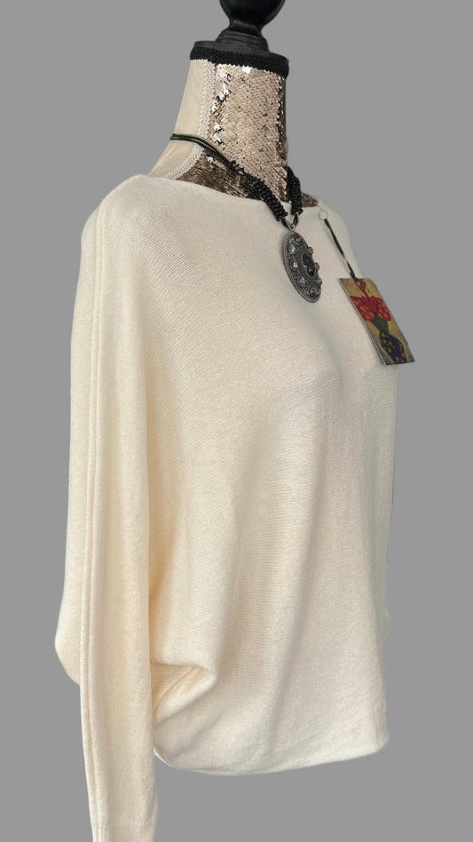 Cream jumper with elegant pearl detailing on the back