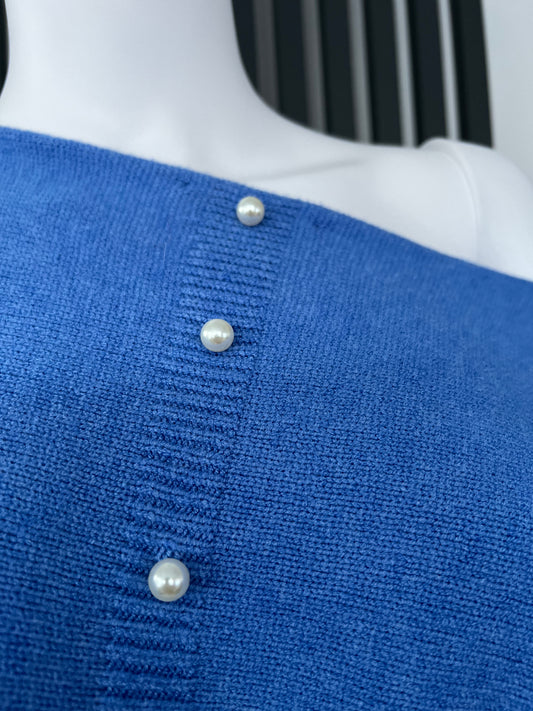 Denim blue jumper with elegant pearl detailing on the back